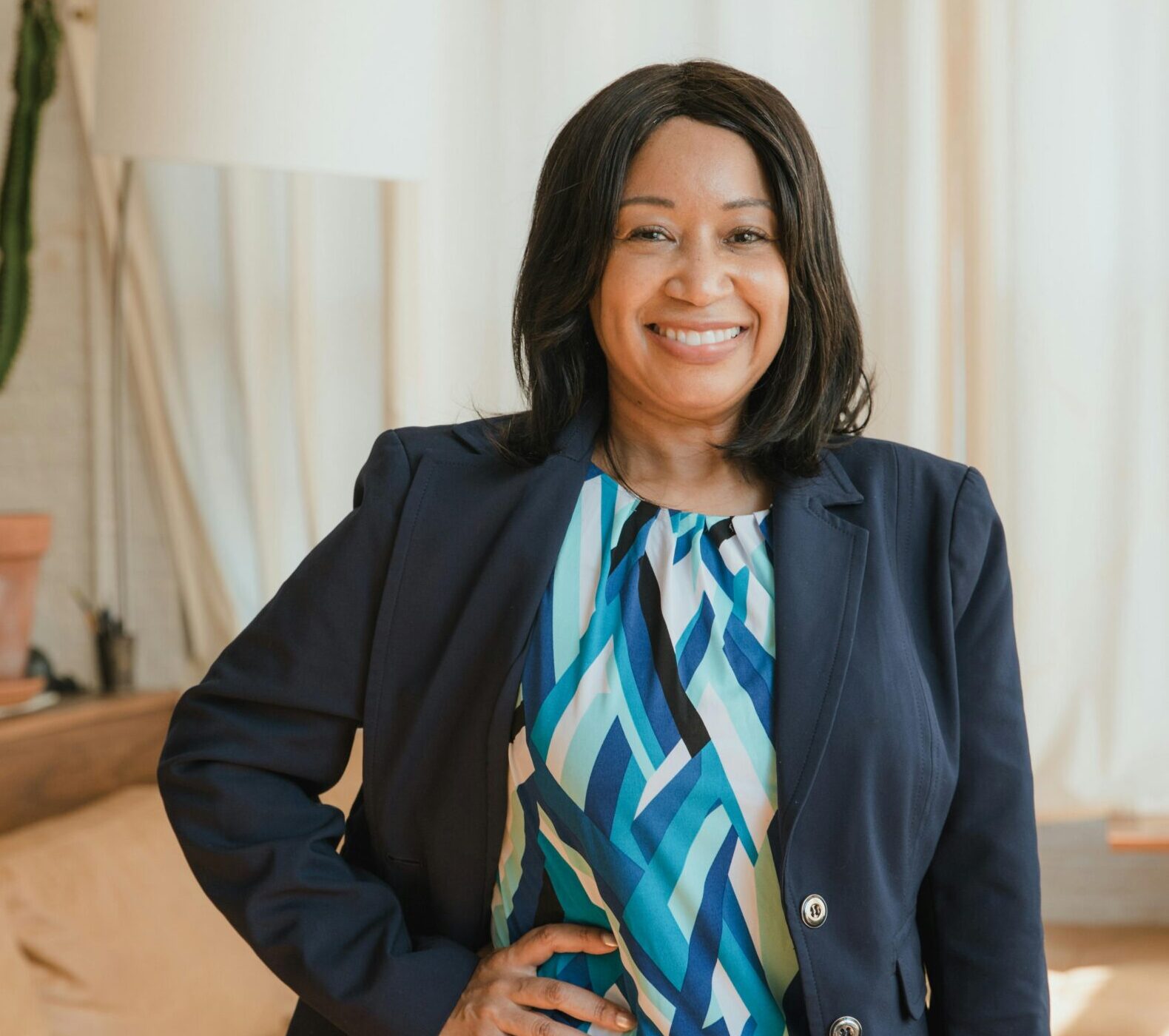 Professional mediator, standing with a smile. Hand on hip