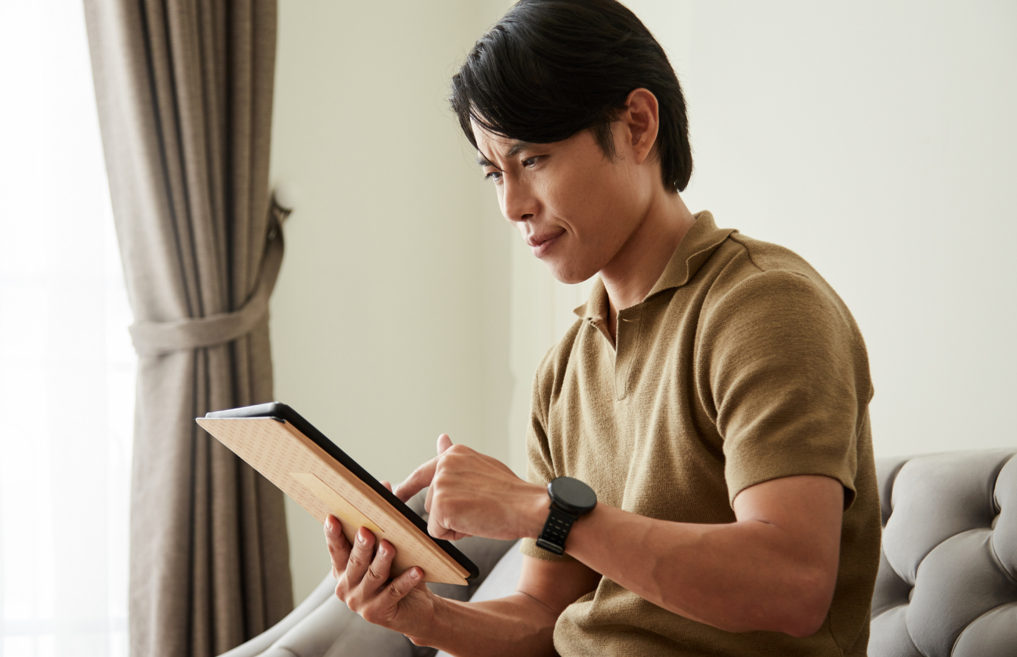 online dating divorce, man scrolling on tablet