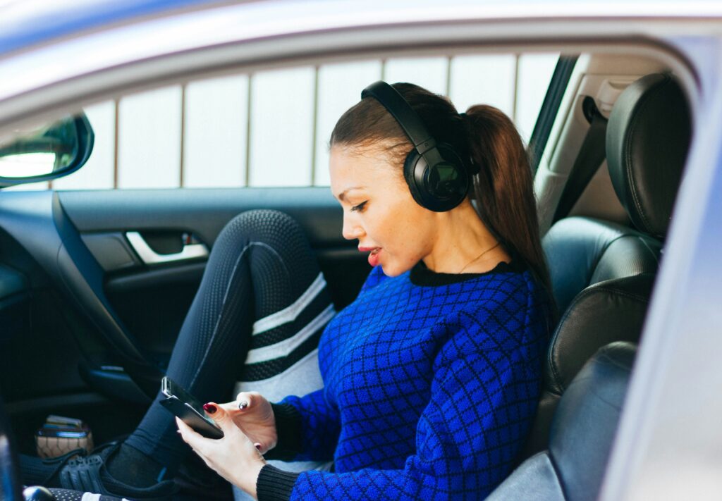 Person listening to music in car.