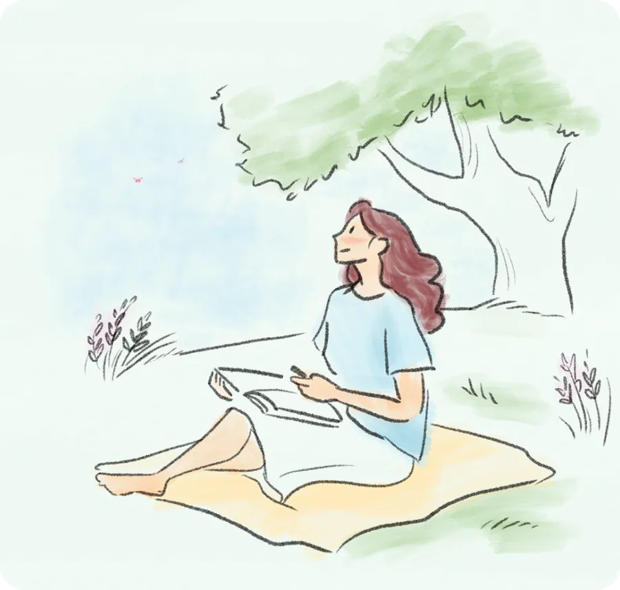A woman reading under a tree