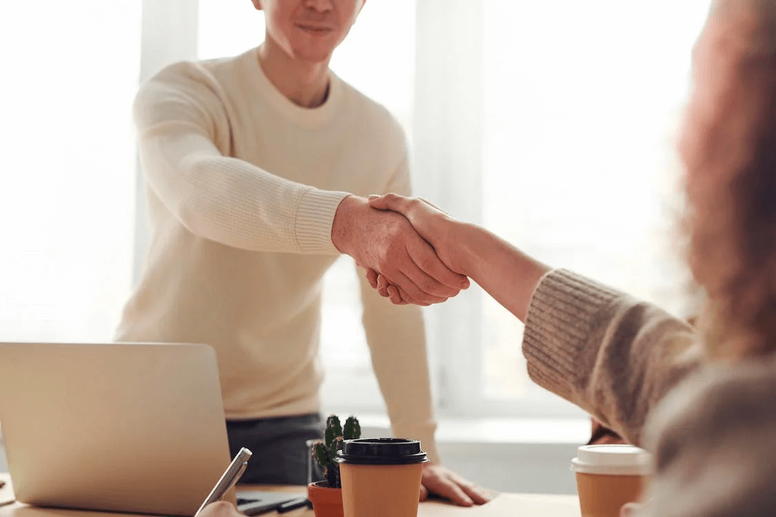Image of a two people in a handshake