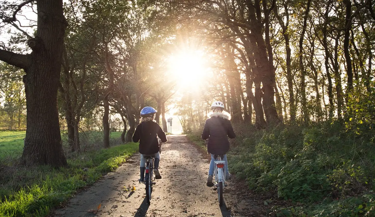 This is an image of two children riding bicycles