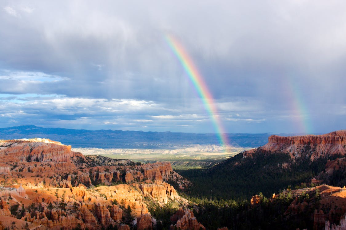 This is an image of a rainbow coming through storms at Bryce Canyon National Park.