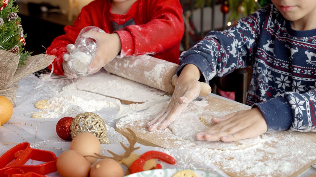 closeup,of,two,boys,making,dough,and,using,rolling,pin